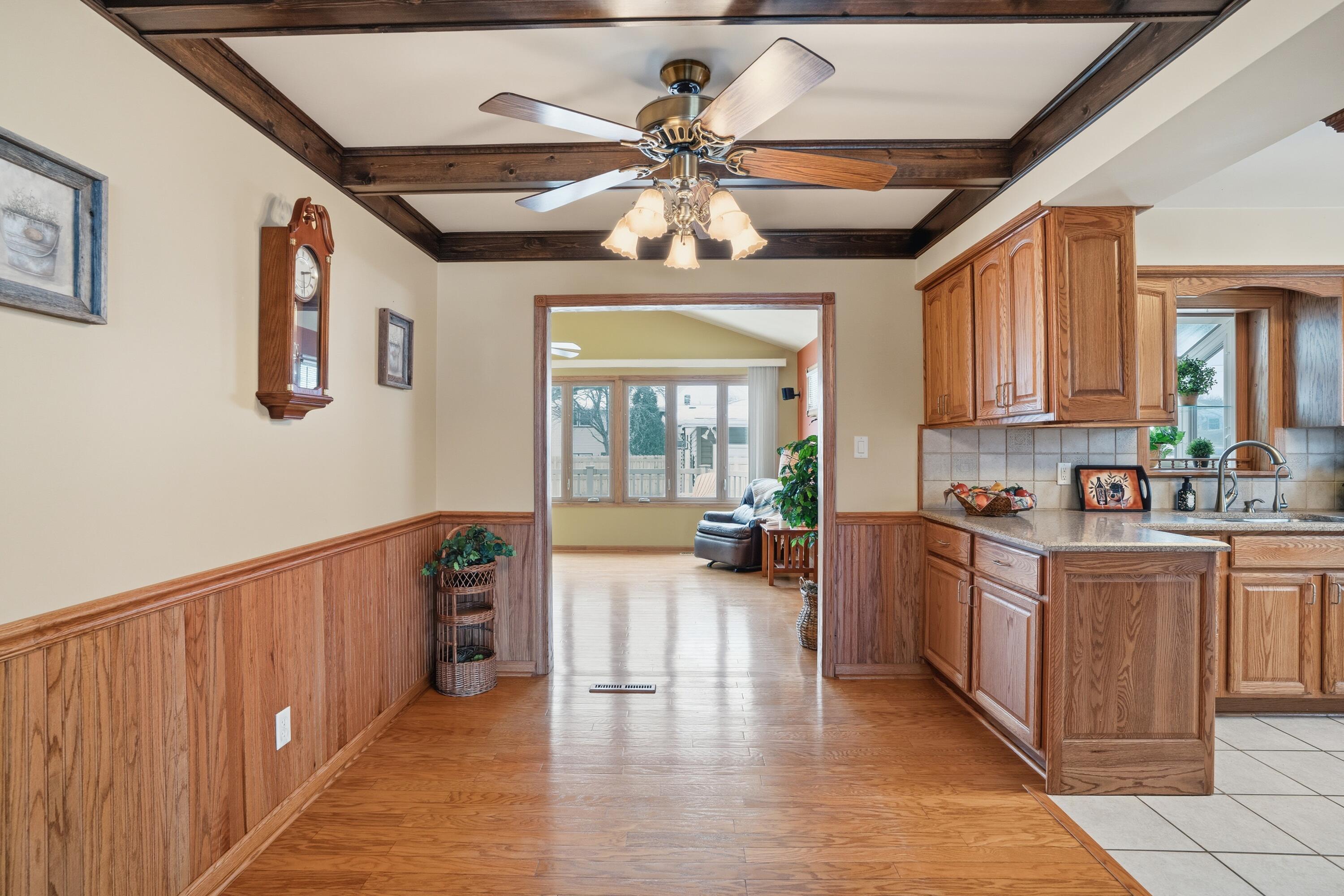 3514 41st Place Highland, IN 46322 - Photo 8 of 26 a large kitchen with stainless steel appliances granite countertop a stove and a wooden floors