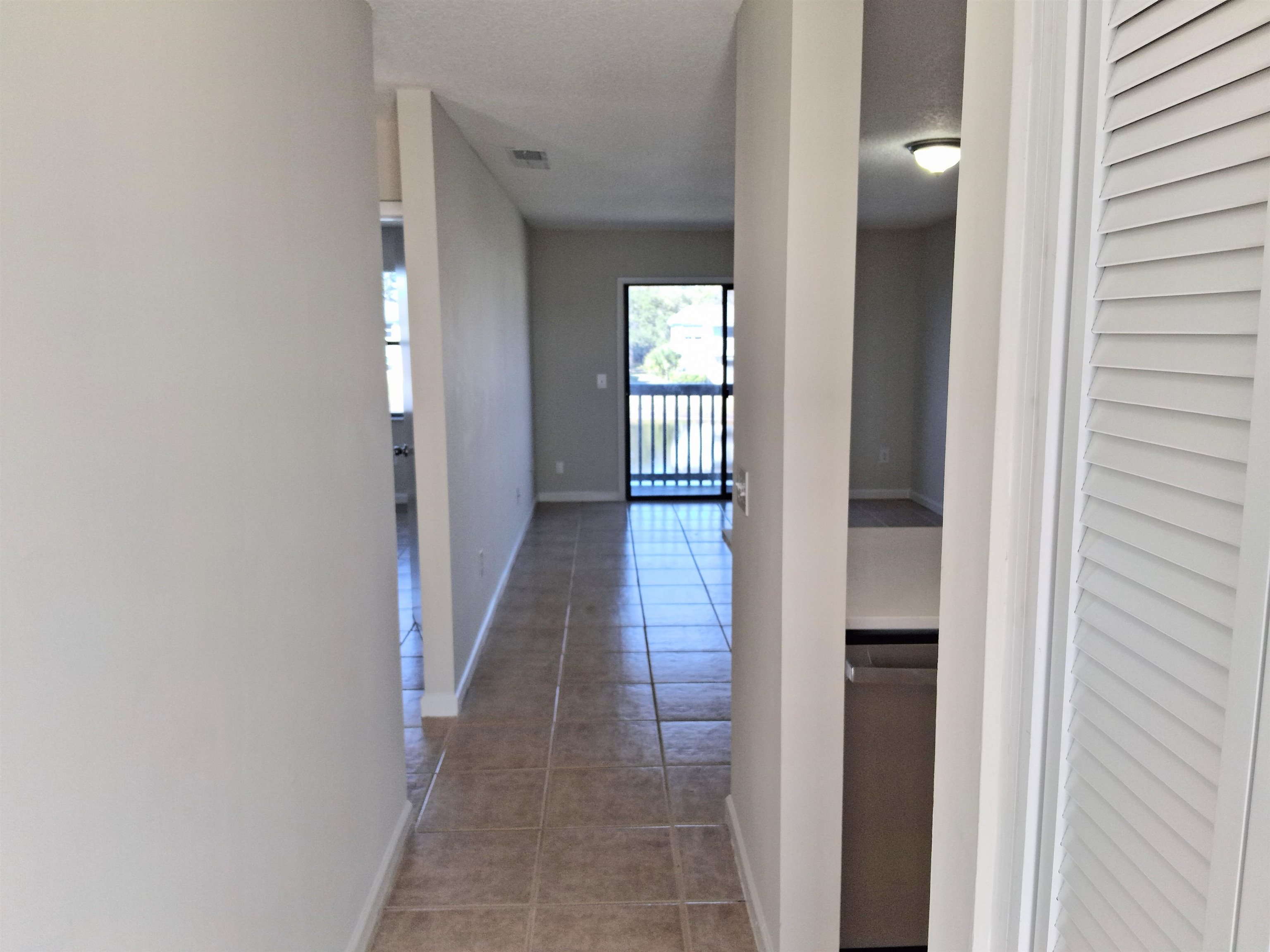 700 West Pope Road, Unit G50 St. Augustine, FL 32080 - Photo 5 of 10 Hallway with light tile patterned flooring