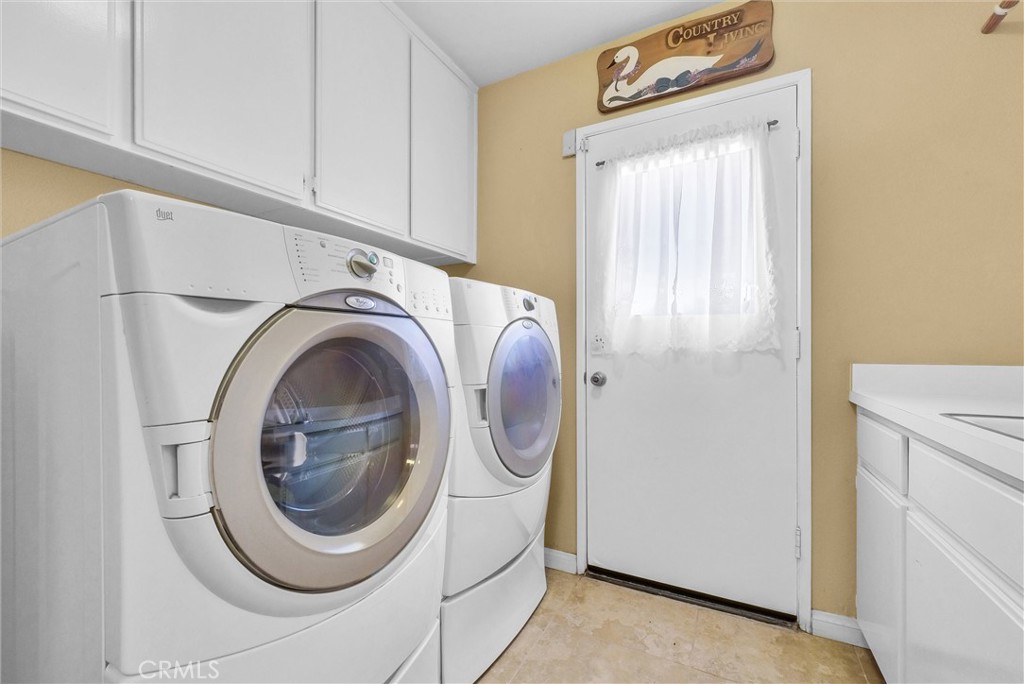 17358 Cold Spring Circle Riverside, CA 92503 - Photo 12 of 34 a utility room with dryer and washer