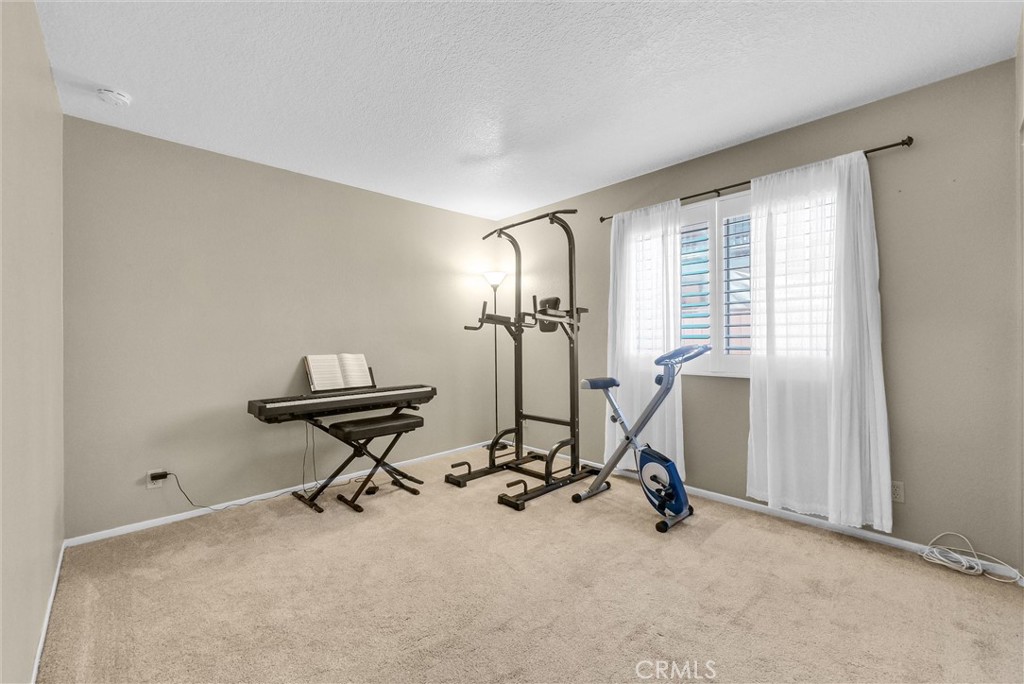 17358 Cold Spring Circle Riverside, CA 92503 - Photo 14 of 34 a view of a room with gym equipment