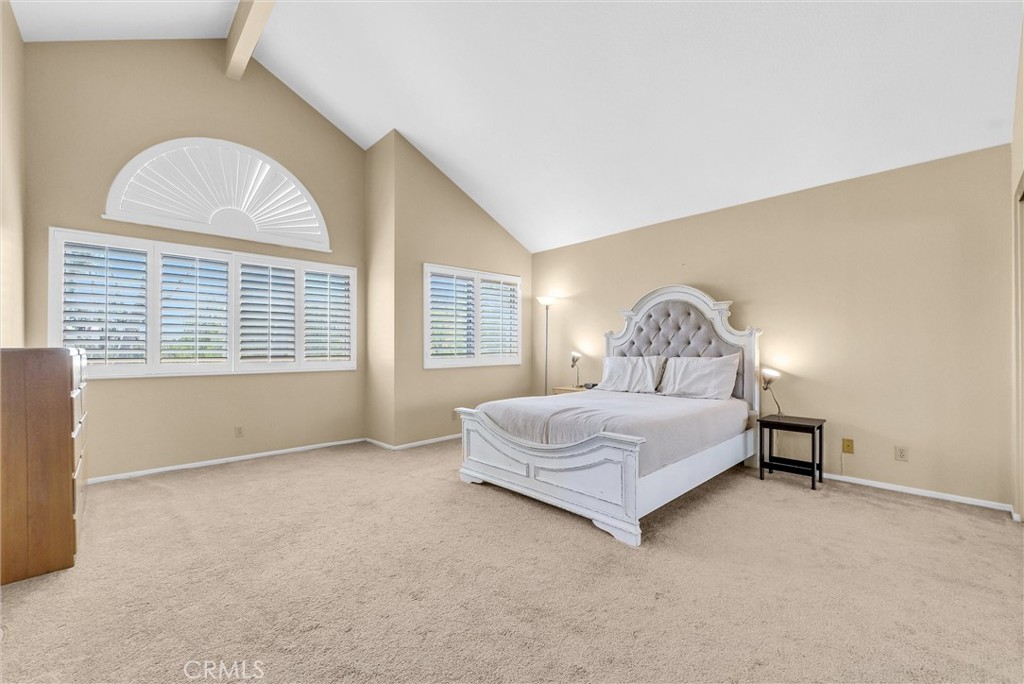 17358 Cold Spring Circle Riverside, CA 92503 - Photo 16 of 34 a bedroom with a bed and a large window