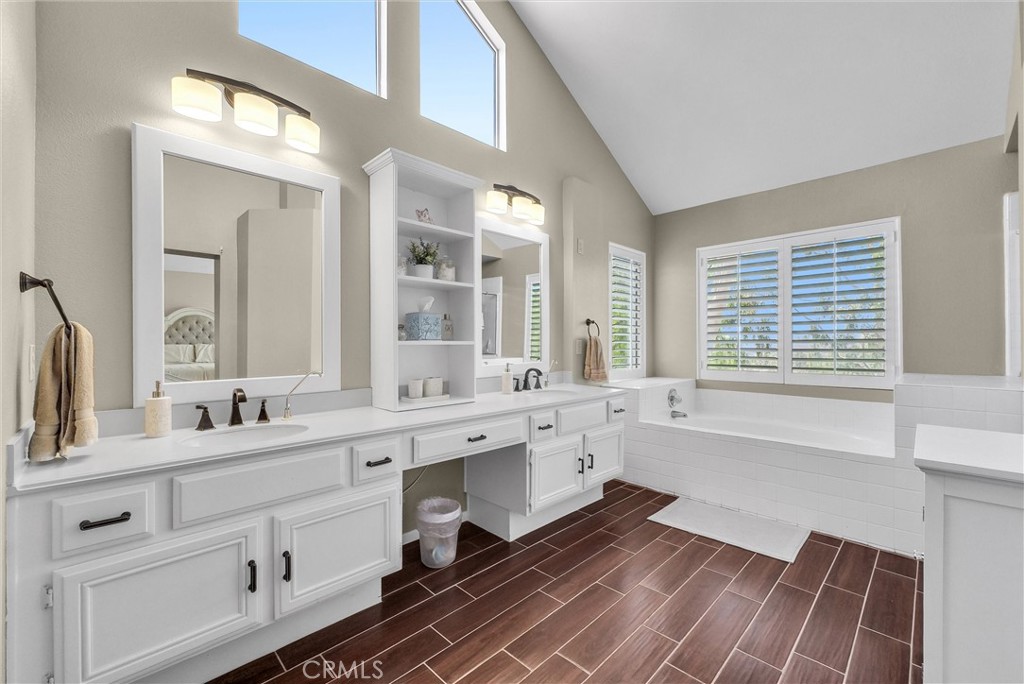 17358 Cold Spring Circle Riverside, CA 92503 - Photo 18 of 34 a large bathroom with double vanity and a large mirror