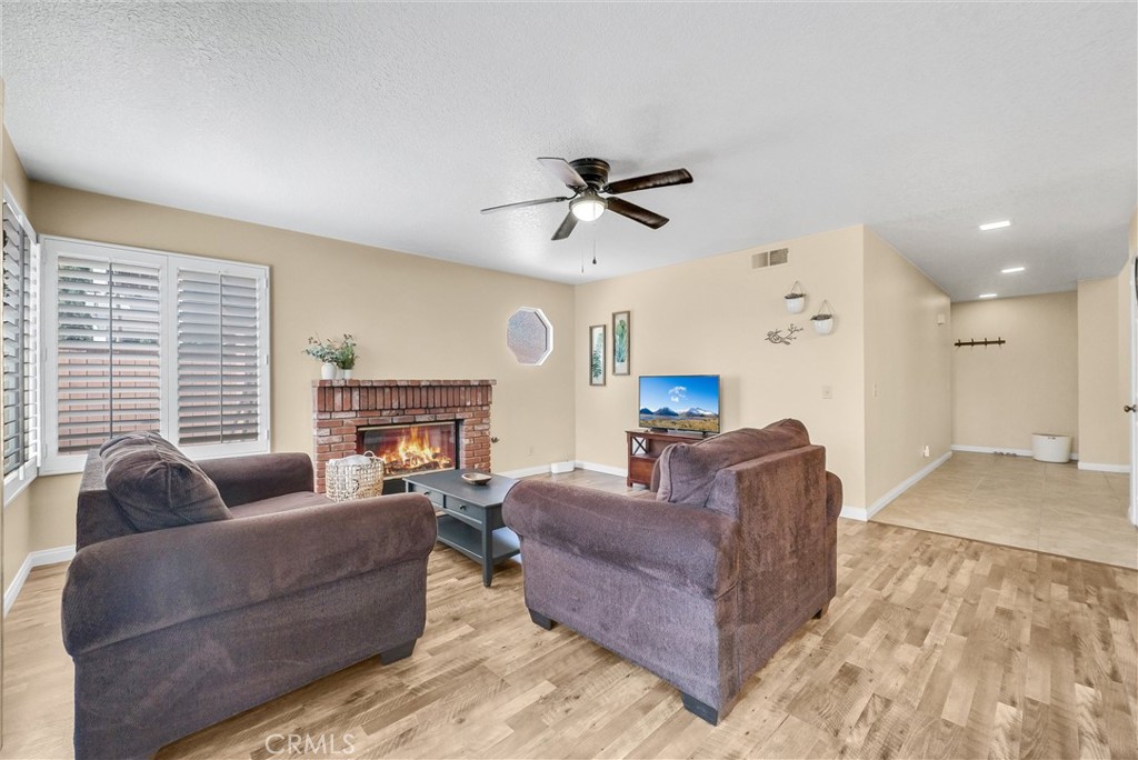 17358 Cold Spring Circle Riverside, CA 92503 - Photo 9 of 34 a living room with furniture and a large window