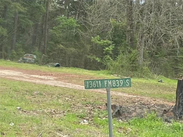 a view of a street with sign board