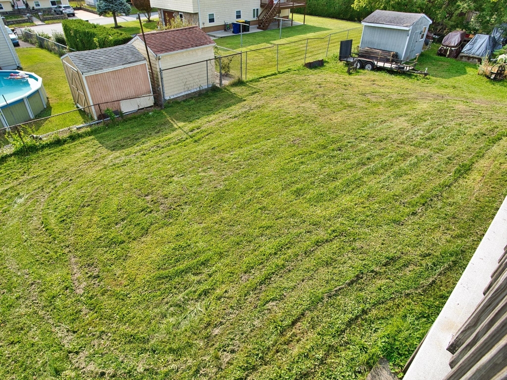 170 Nelson Street Fall River, MA 02721 - Photo 13 of 42 a backyard of a house with a garden and plants