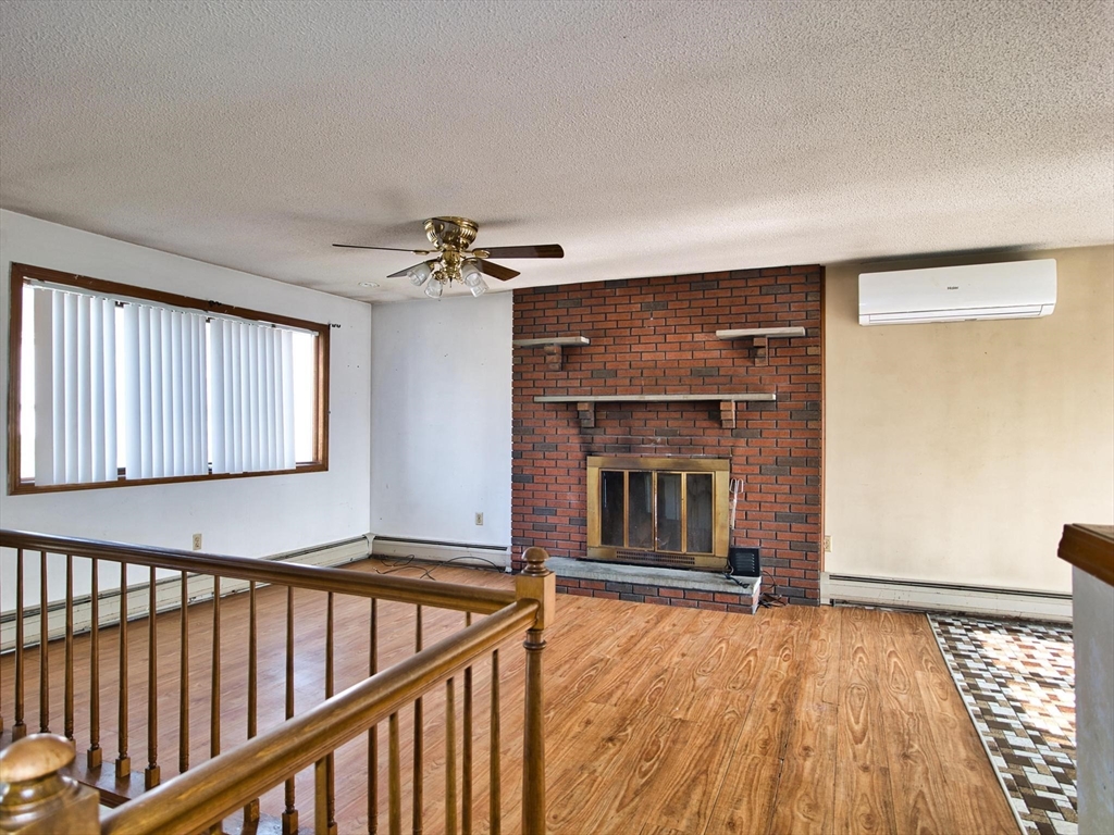 170 Nelson Street Fall River, MA 02721 - Photo 15 of 42 a view of an empty room with wooden floor and a window
