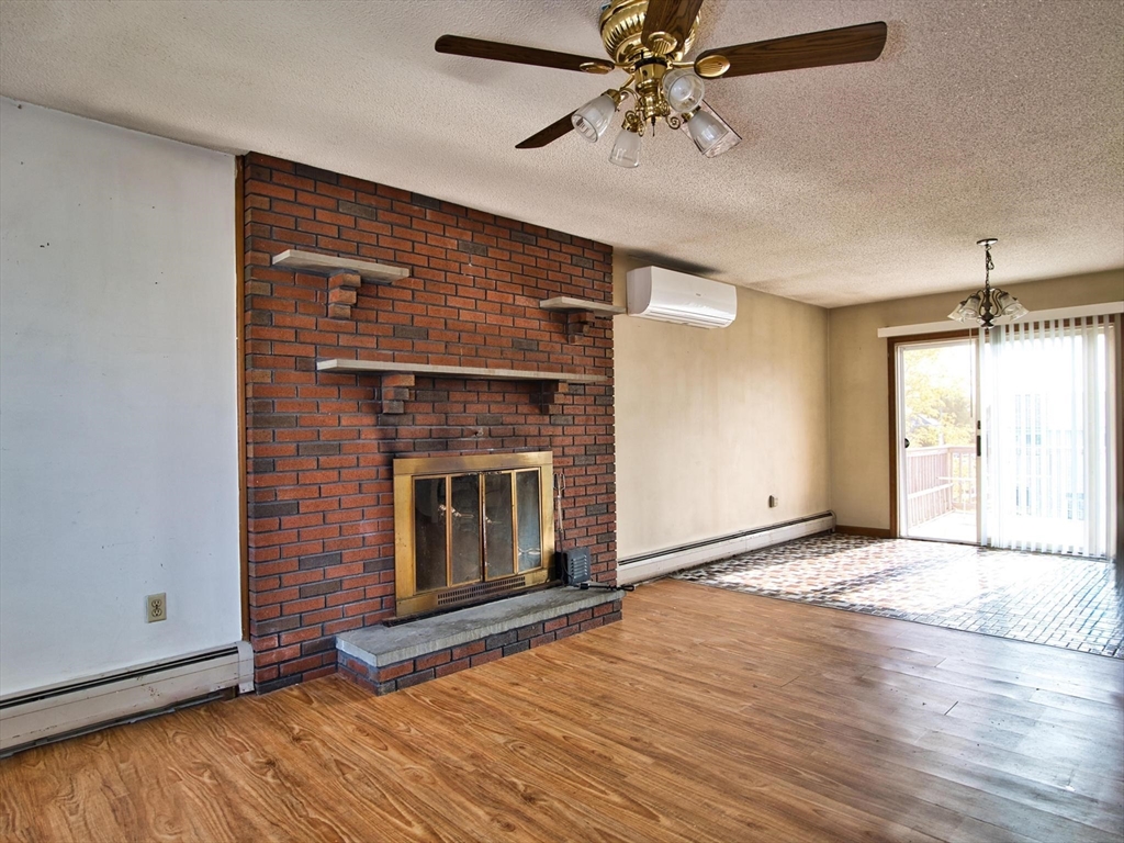 170 Nelson Street Fall River, MA 02721 - Photo 16 of 42 a view of an empty room with wooden floor and a window