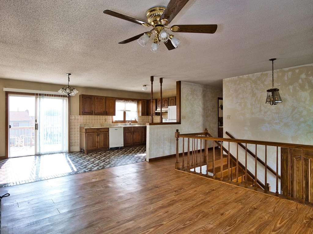 170 Nelson Street Fall River, MA 02721 - Photo 18 of 42 a kitchen with kitchen island a stove and a chandelier