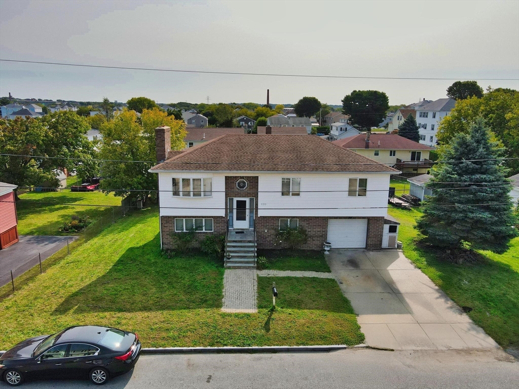 170 Nelson Street Fall River, MA 02721 - Photo 2 of 42 front view of a house with a yard