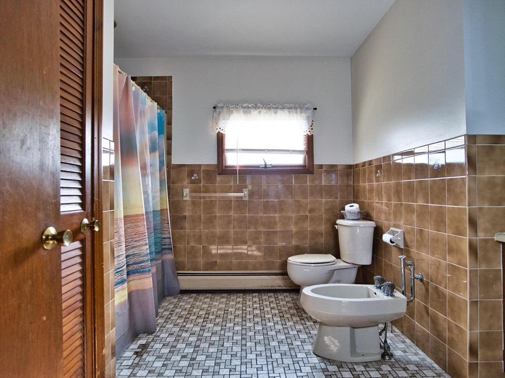 170 Nelson Street Fall River, MA 02721 - Photo 24 of 42 a bathroom with a toilet a window and shower