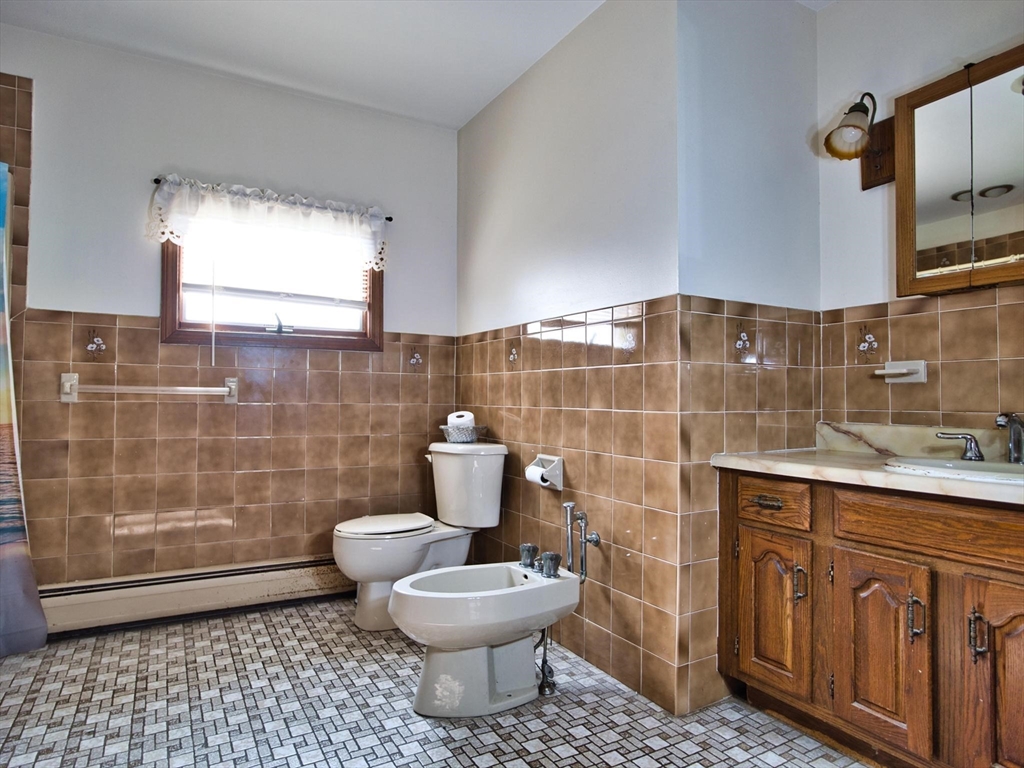 170 Nelson Street Fall River, MA 02721 - Photo 25 of 42 a bathroom with a toilet a sink and mirror