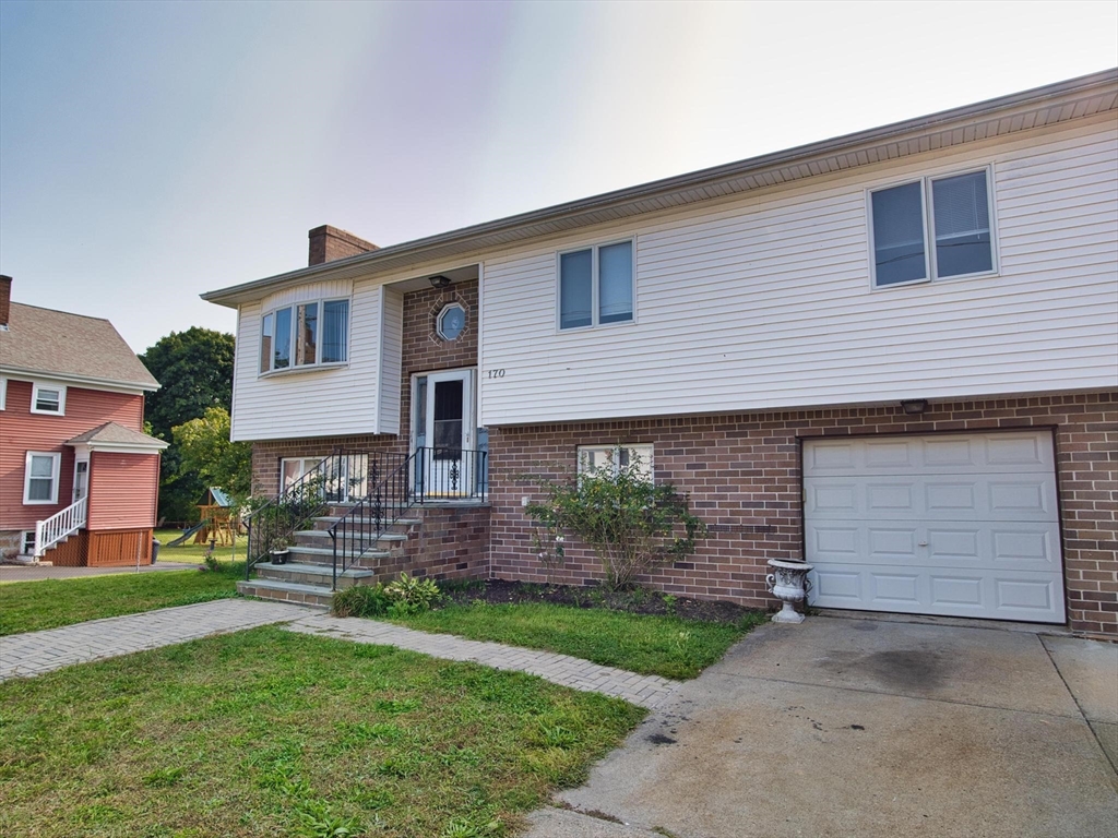 170 Nelson Street Fall River, MA 02721 - Photo 4 of 42 a front view of a house with garden