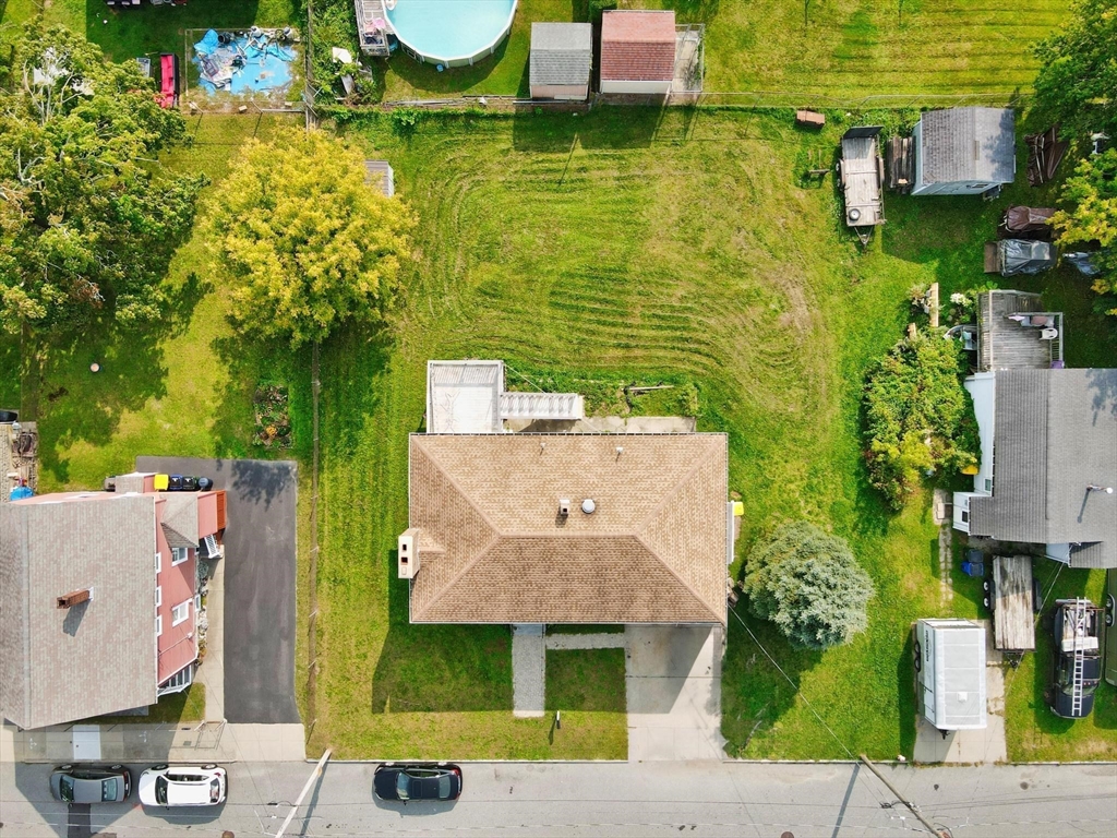170 Nelson Street Fall River, MA 02721 - Photo 5 of 42 an aerial view of a house with swimming pool and large trees