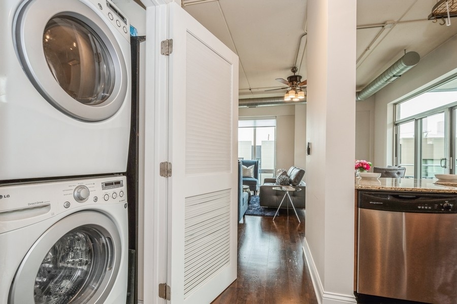 4814 North Clark Street, Unit 201 Chicago, IL 60640 - Photo 20 of 24 a view of a hallway with washer and dryer