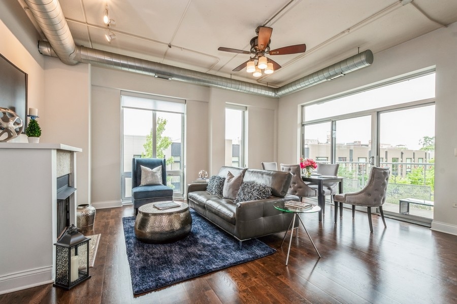 4814 North Clark Street, Unit 201 Chicago, IL 60640 - Photo 3 of 24 a living room with furniture and a large window