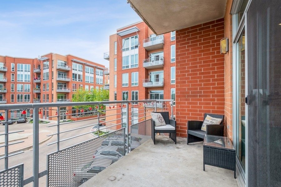 4814 North Clark Street, Unit 201 Chicago, IL 60640 - Photo 23 of 24 a building outdoor space with patio furniture