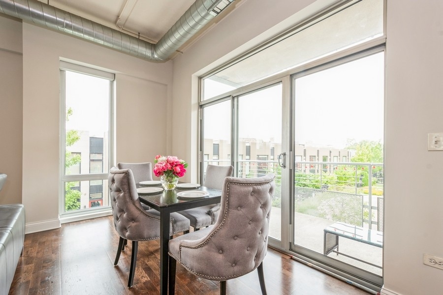4814 North Clark Street, Unit 201 Chicago, IL 60640 - Photo 8 of 24 a room with furniture and wooden floor