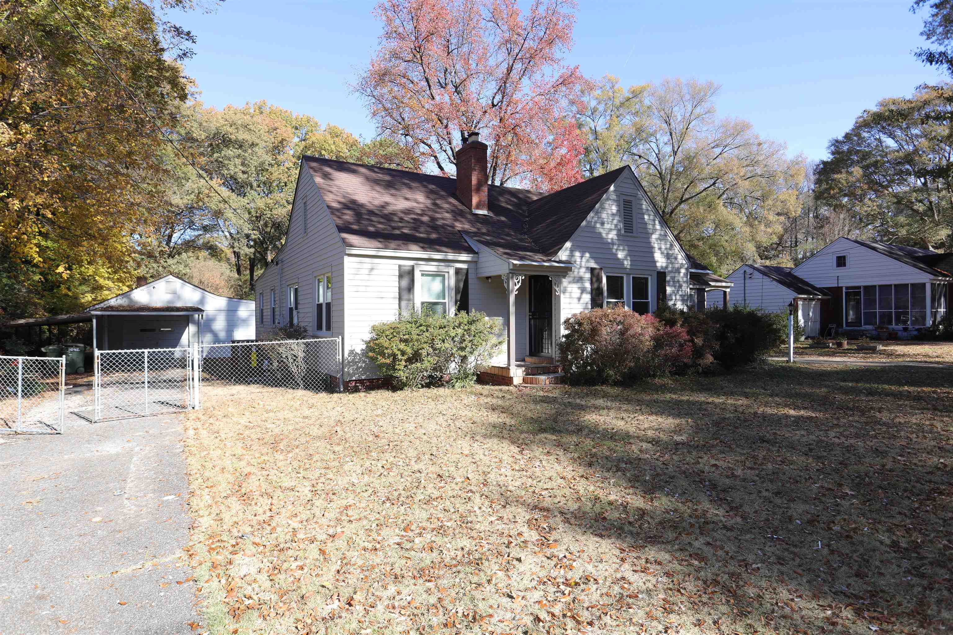1042 Mosby Road Memphis, TN 38116 - Photo 2 of 21 a front view of a house with yard and seating area