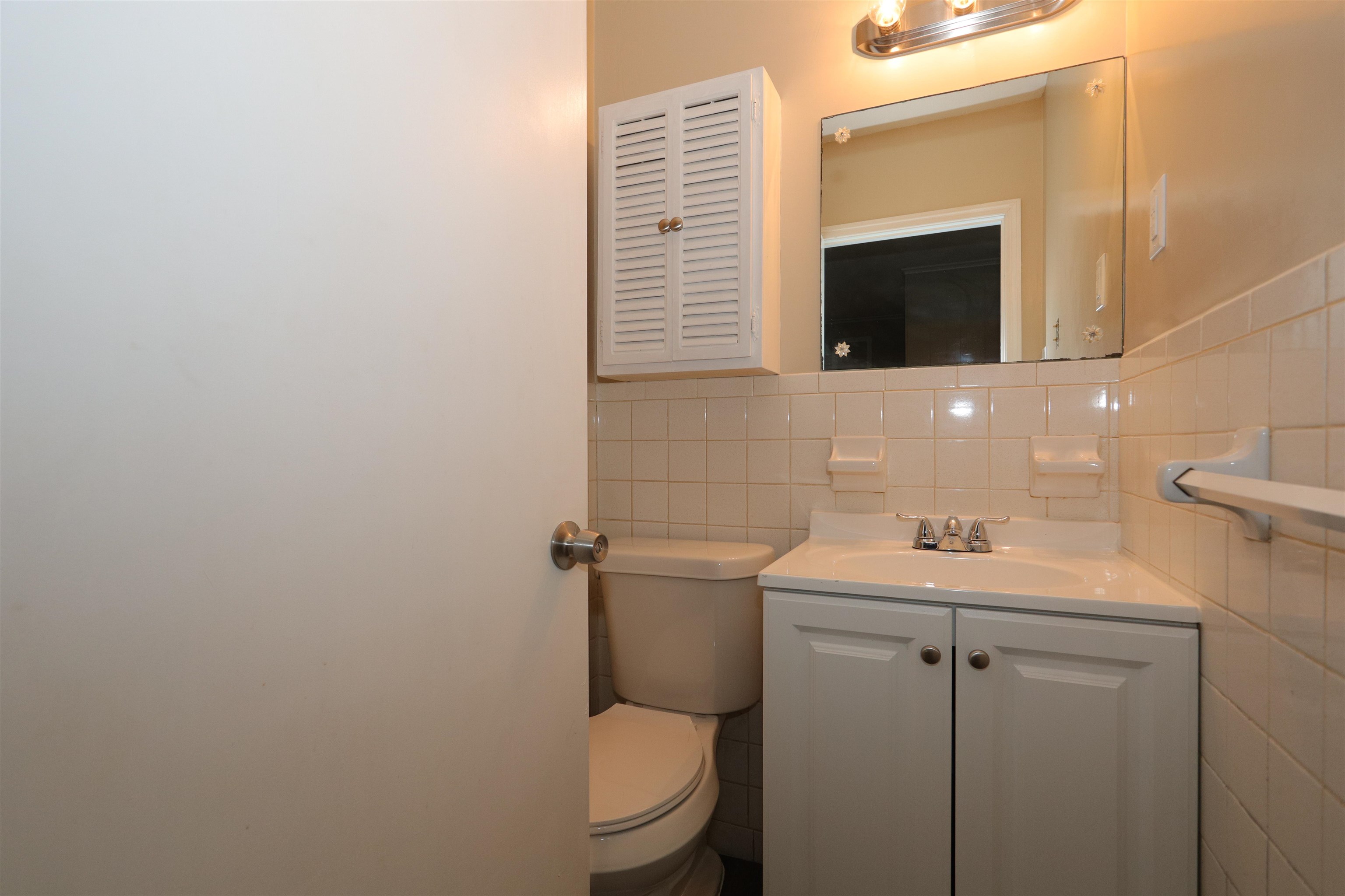 1042 Mosby Road Memphis, TN 38116 - Photo 13 of 21 a bathroom with a toilet sink and mirror