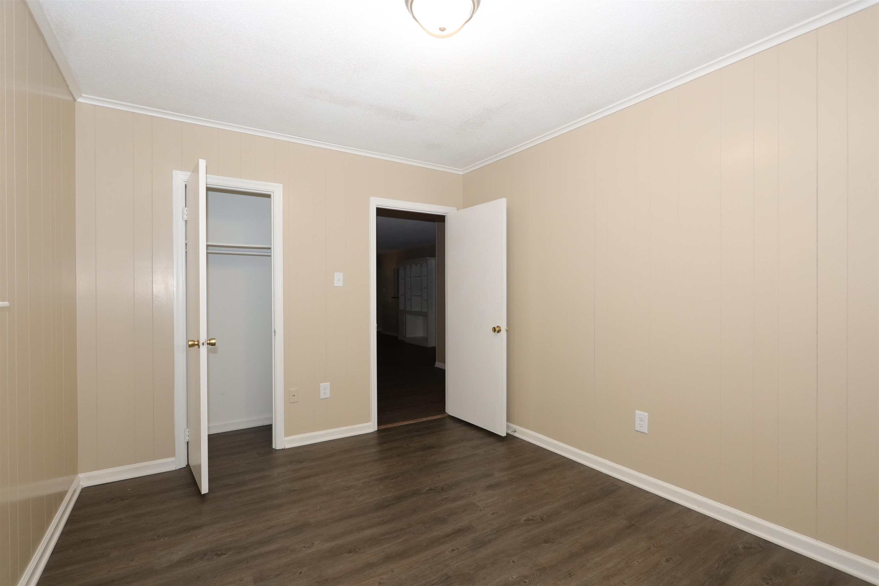 1042 Mosby Road Memphis, TN 38116 - Photo 14 of 21 a view of an empty room with wooden floor