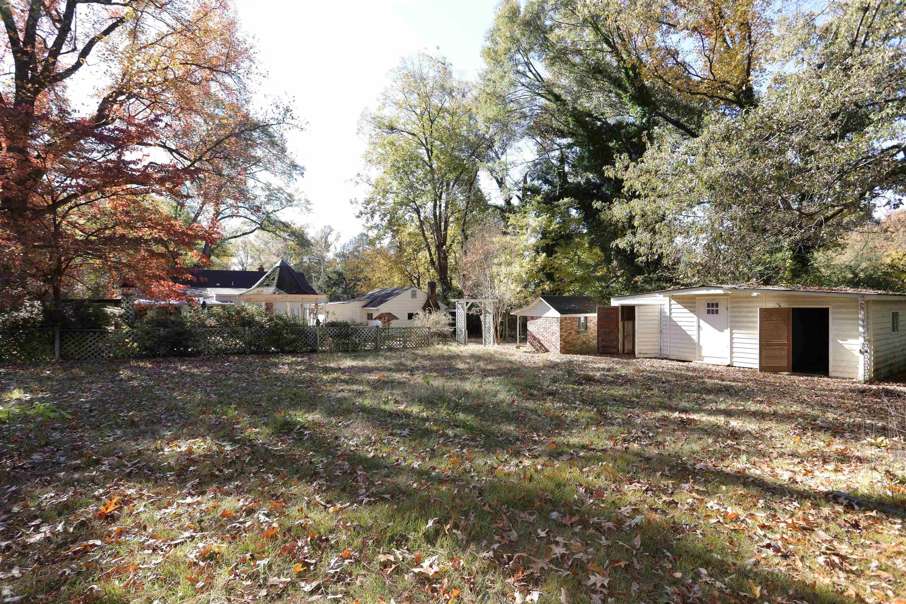 1042 Mosby Road Memphis, TN 38116 - Photo 7 of 21 a view of a house with a yard