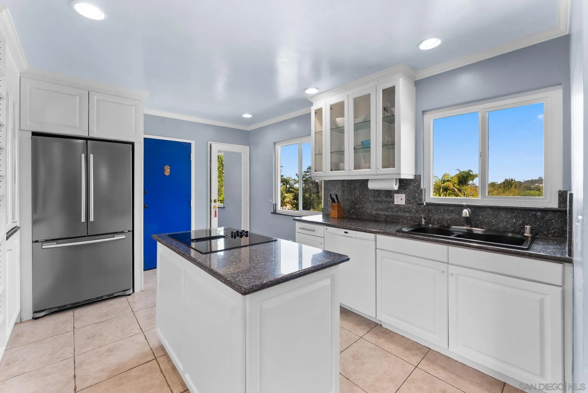 2360 Torrey Pines Road, Unit 28 La Jolla, CA 92037 - Photo 11 of 35 a kitchen with stainless steel appliances granite countertop a sink stove and refrigerator