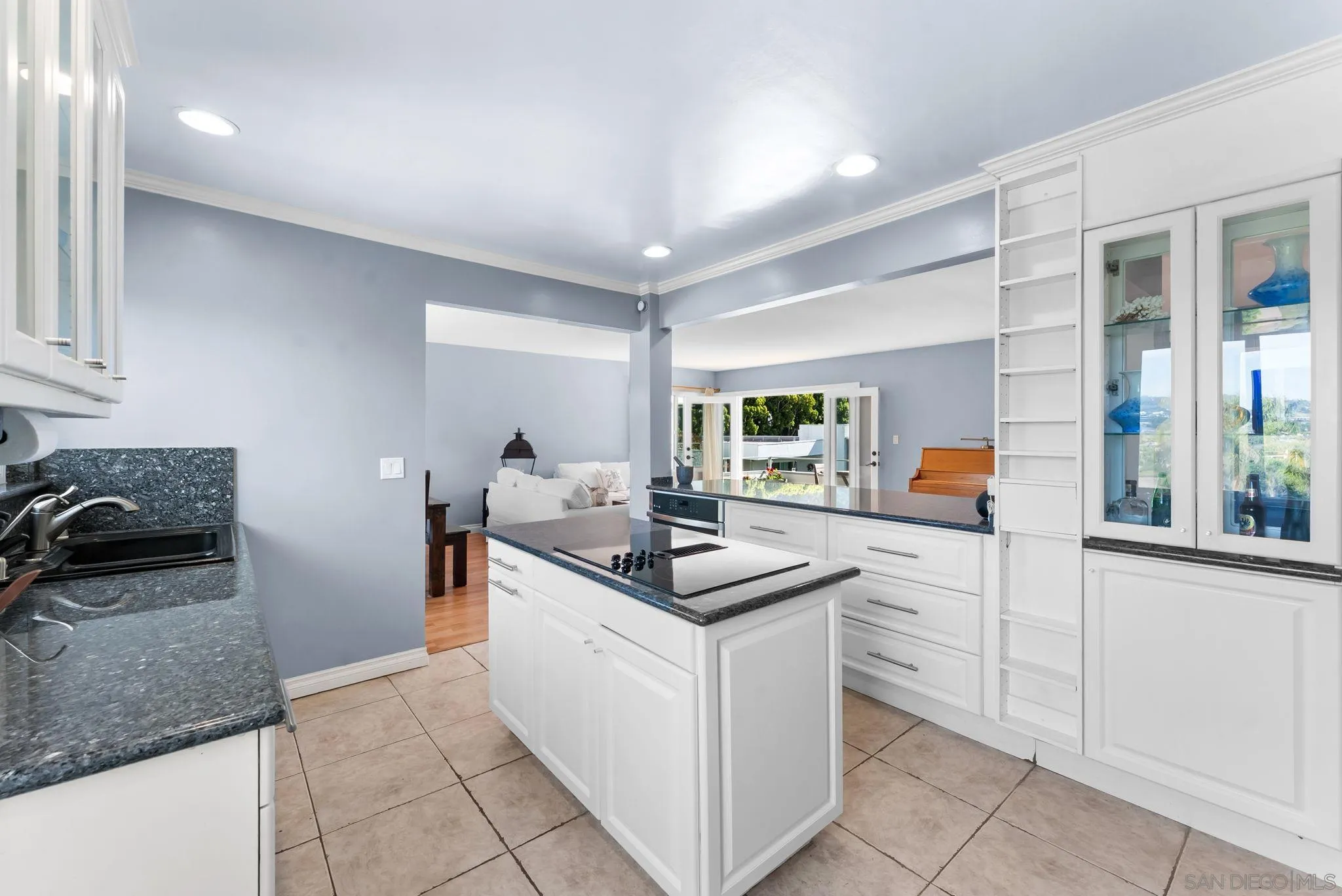 2360 Torrey Pines Road, Unit 28 La Jolla, CA 92037 - Photo 12 of 35 a kitchen with stainless steel appliances granite countertop a sink and cabinets