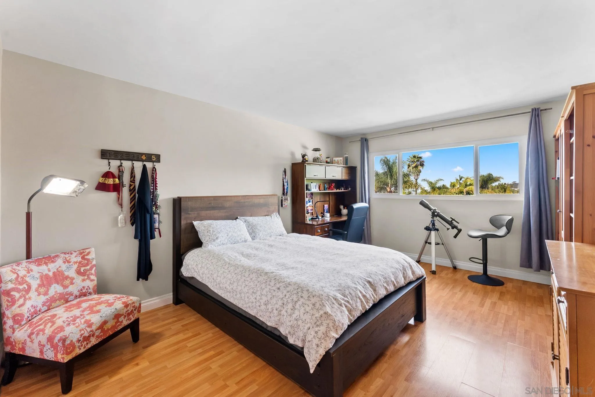 2360 Torrey Pines Road, Unit 28 La Jolla, CA 92037 - Photo 17 of 35 a bedroom with a bed and a dresser in it