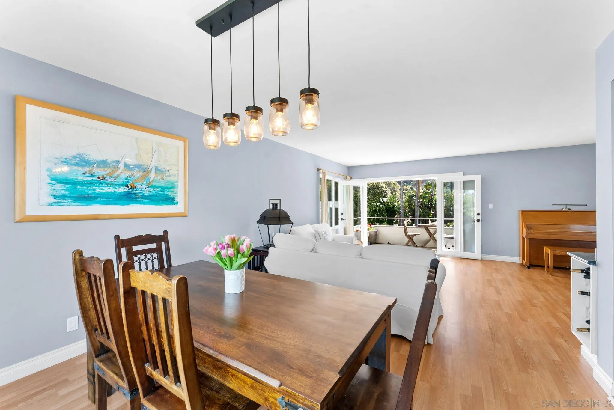 2360 Torrey Pines Road, Unit 28 La Jolla, CA 92037 - Photo 5 of 35 a view of a dining room with furniture a livingroom and chandelier