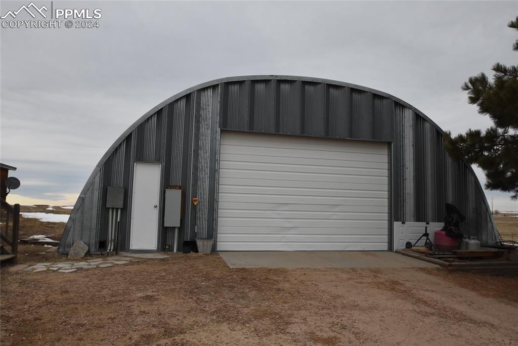 9990 Hahn Road Calhan, CO 80808 - Photo 14 of 25 a view of a house with backyard and garage