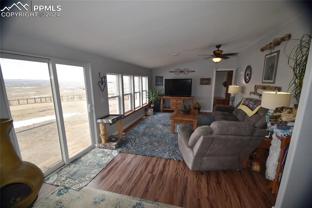 9990 Hahn Road Calhan, CO 80808 - Photo 8 of 25 a living room with furniture and a table