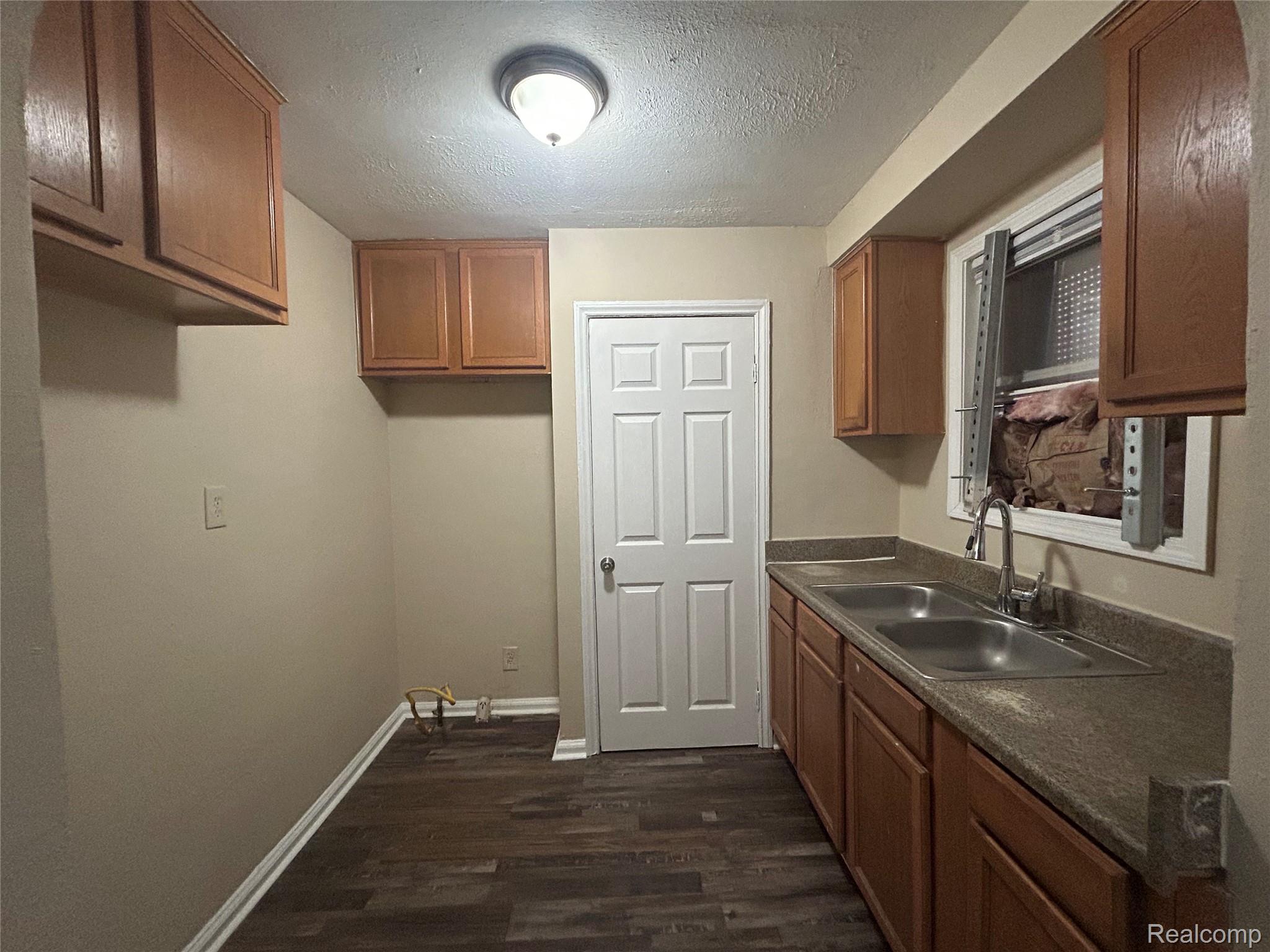 16824 Rutherford Street Detroit, MI 48235 - Photo 2 of 25 Kitchen featuring wood-finish flooring, light tan walls, and a white ceiling