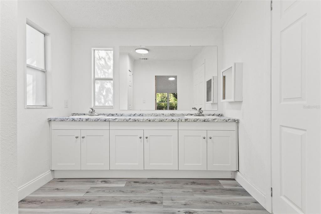 6718 West Pershing Drive Homosassa, FL 34448 - Photo 21 of 47 a bathroom with granite countertop a sink and a mirror