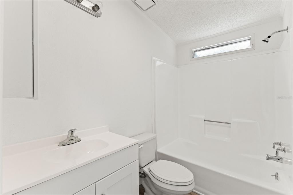 6718 West Pershing Drive Homosassa, FL 34448 - Photo 28 of 47 a bathroom with a sink a toilet and shower