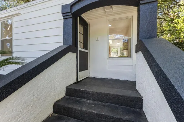 a view of balcony with wooden floor and a potted plant