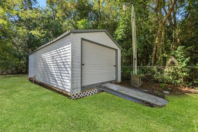 a view of a backyard with a small cabin
