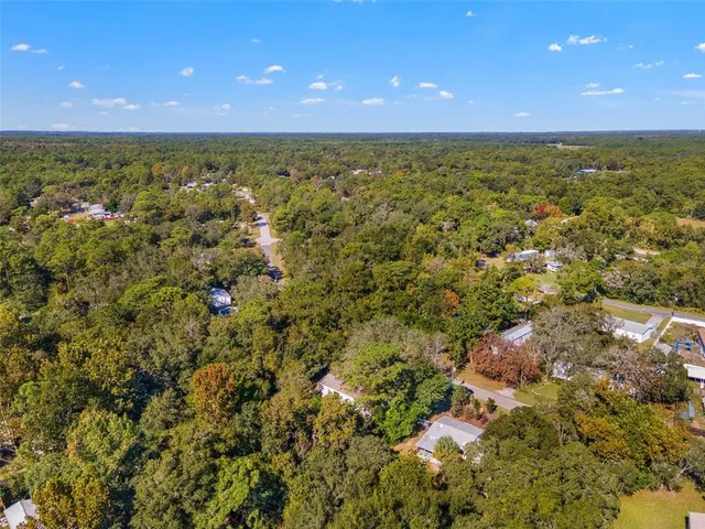 a view of a house with a tree