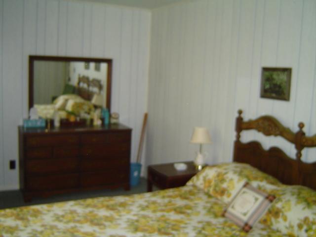 9814 Callaway Road Callaway, VA 24067 - Photo 12 of 14 a bedroom with a bed and a painting on the wall