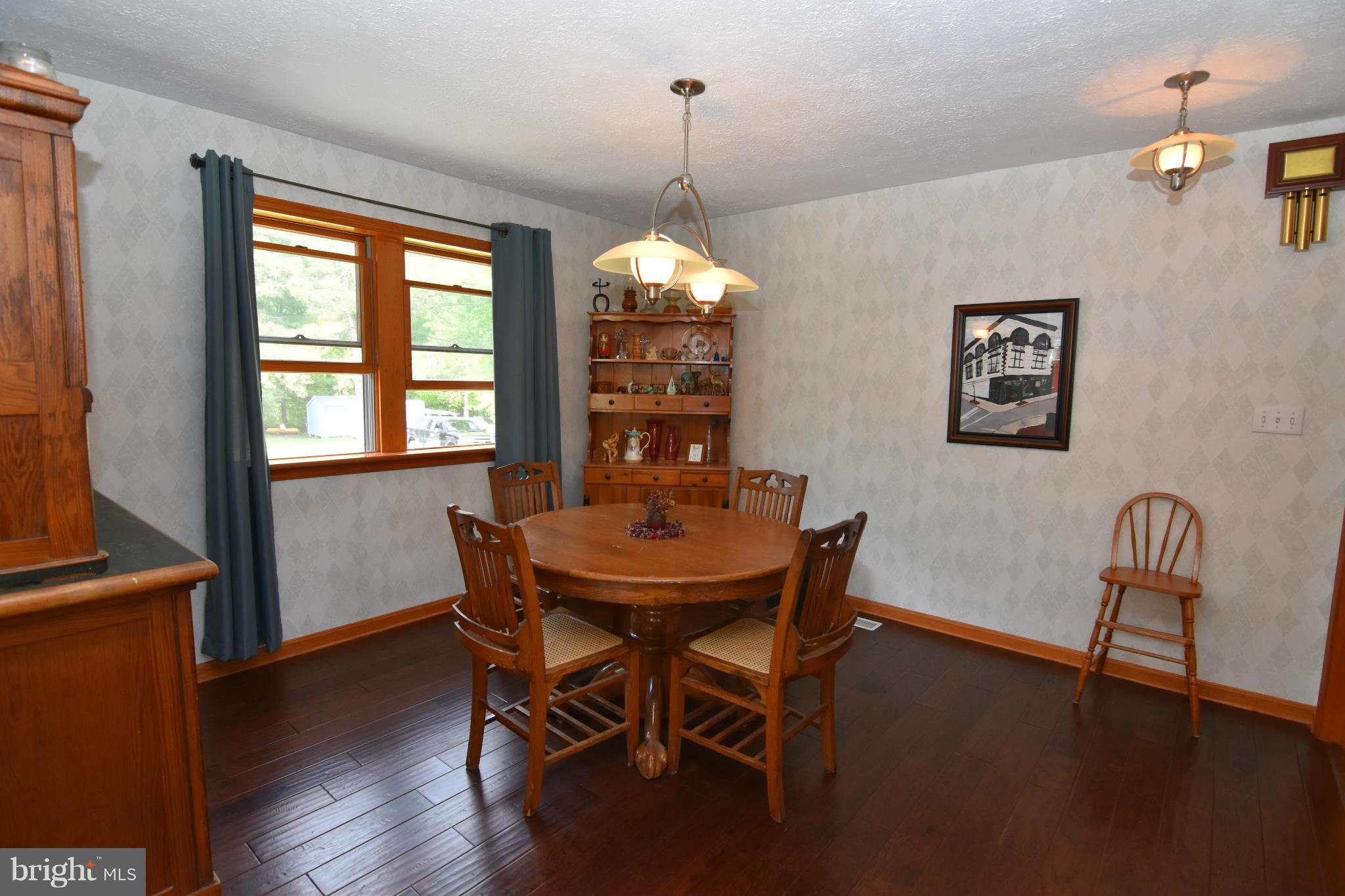 20510 Raceground Road Callaway, MD 20620 - Photo 8 of 30 a dining room with furniture window wooden floor