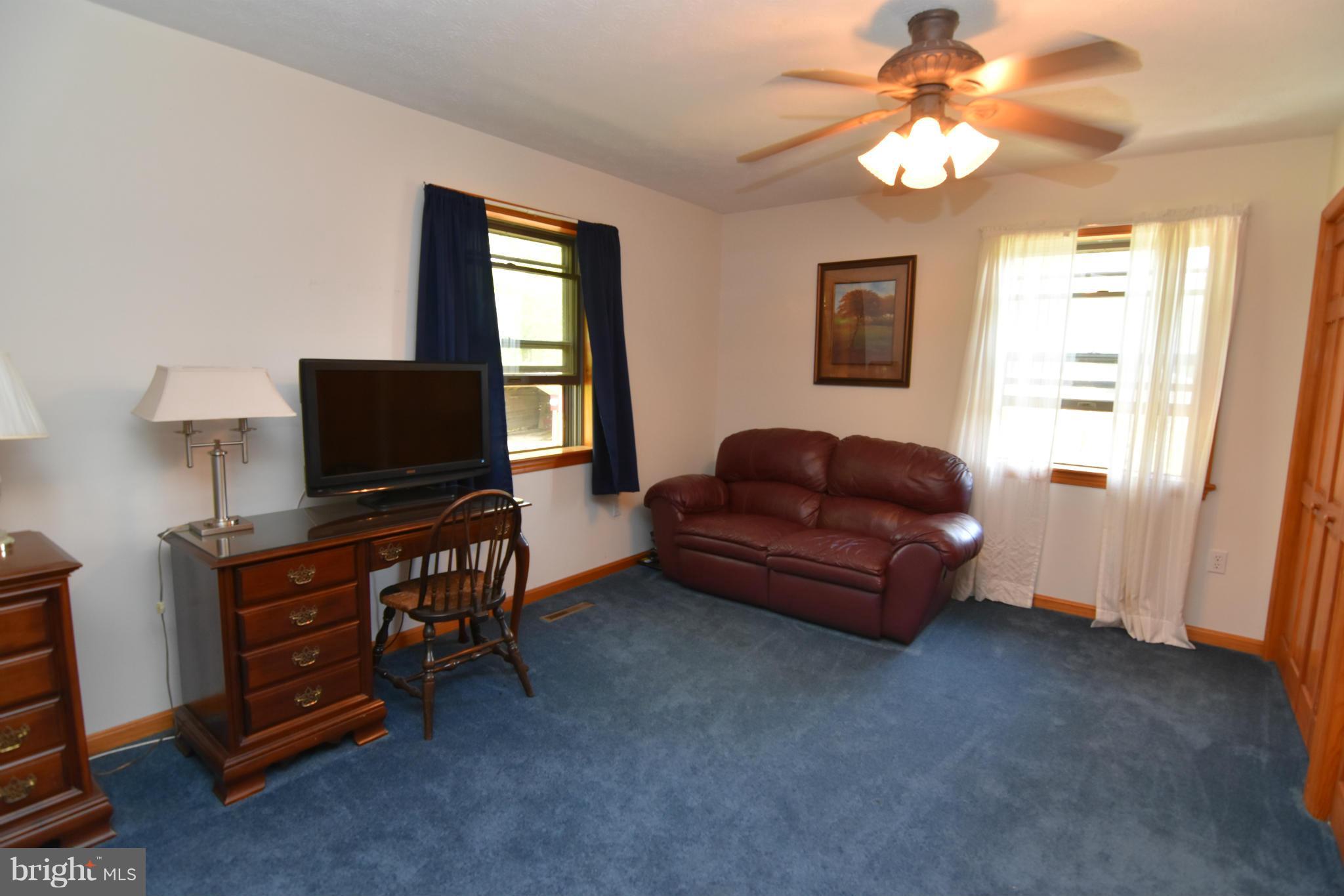 20510 Raceground Road Callaway, MD 20620 - Photo 10 of 30 a living room with furniture and a flat screen tv
