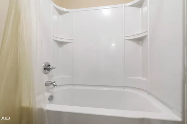 a close view of a bathtub in bathroom
