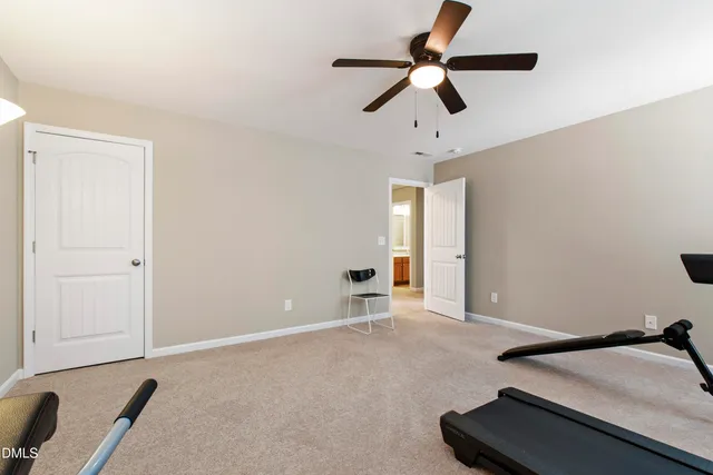 a view of room with a ceiling fan