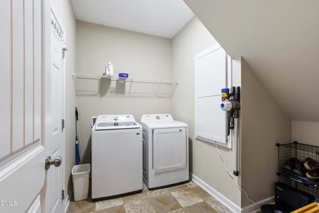 a view of storage and utility room with washer and dryer