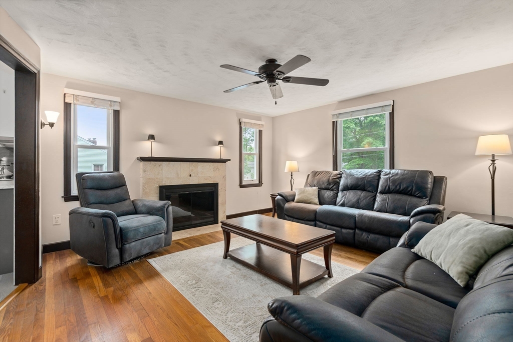 9 Laurel Lane Bellingham, MA 02019 - Photo 18 of 30 a living room with furniture a fireplace and a window