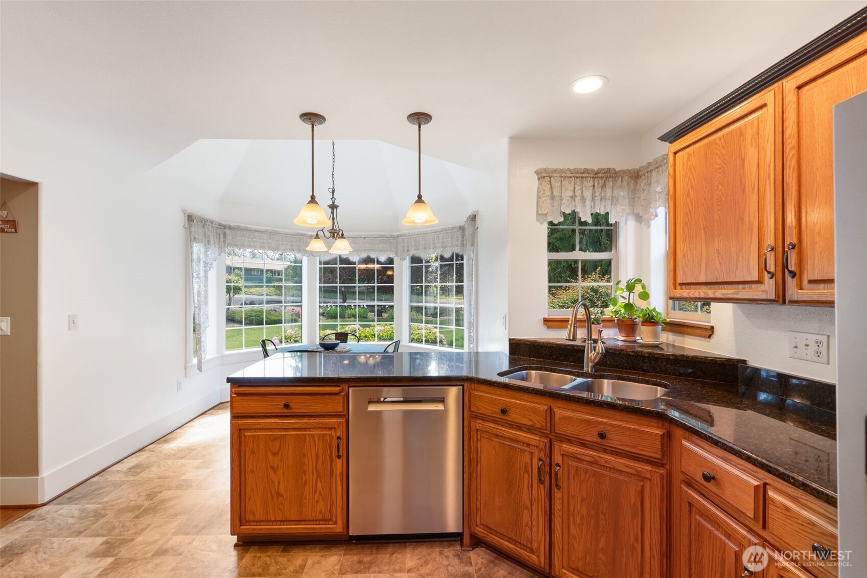 308 Brockway Road Chehalis, WA 98532 - Photo 15 of 40 a kitchen with stainless steel appliances granite countertop a sink a counter space and windows