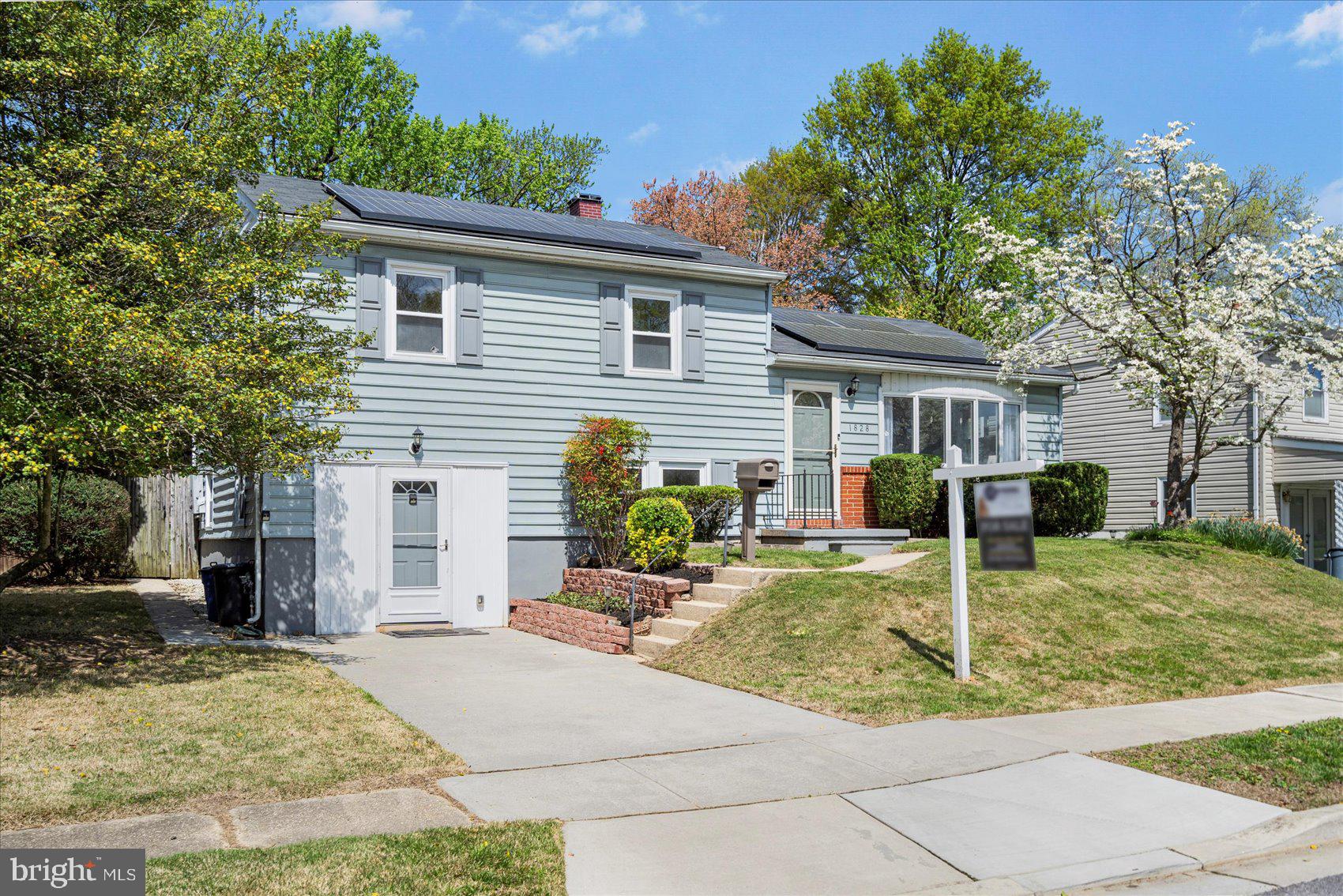 a backyard of a house with yard and outdoor seating