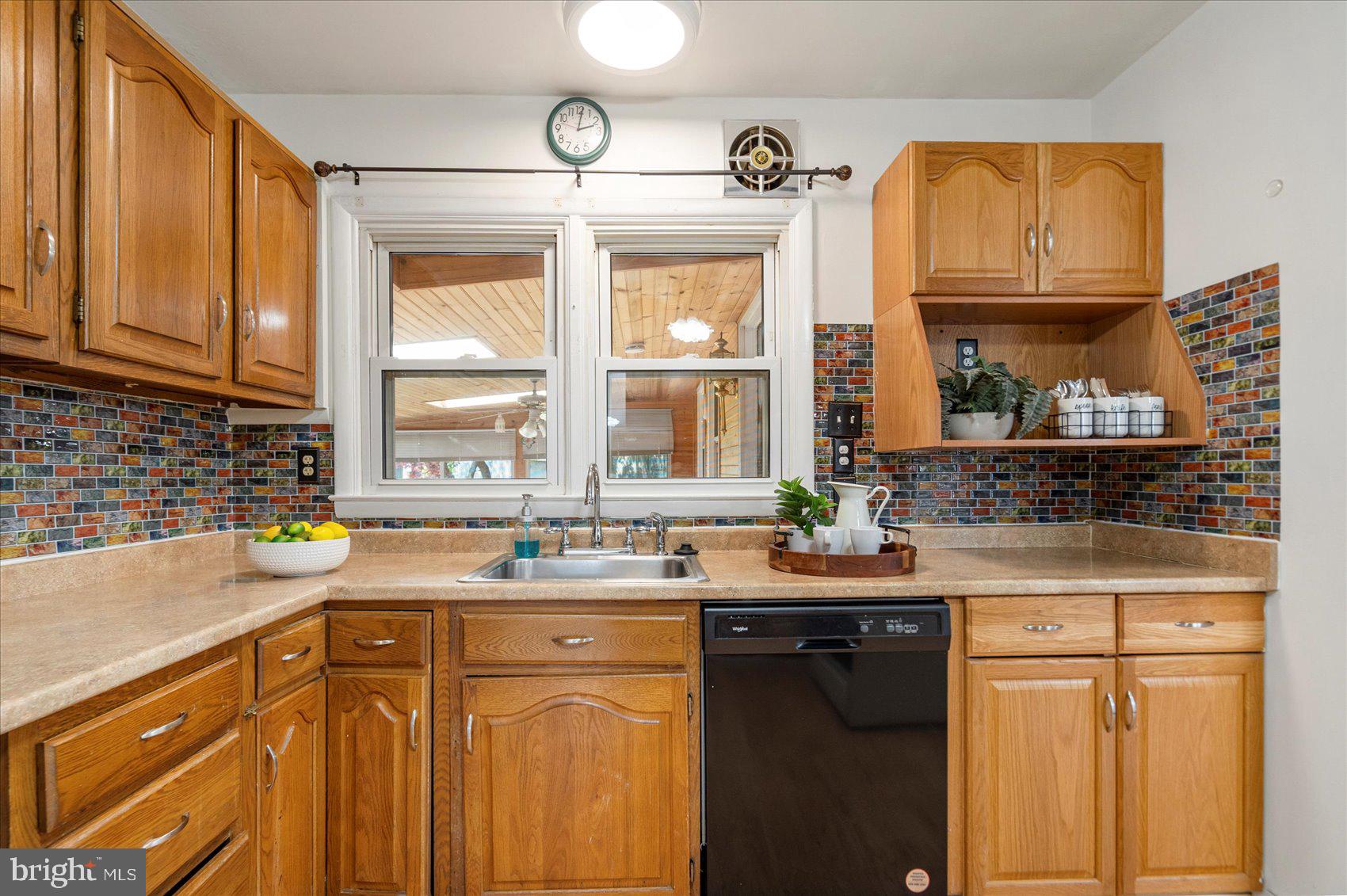 1828 Wycliffe Road Baltimore, MD 21234 - Photo 11 of 41 a kitchen with granite countertop a sink and cabinets