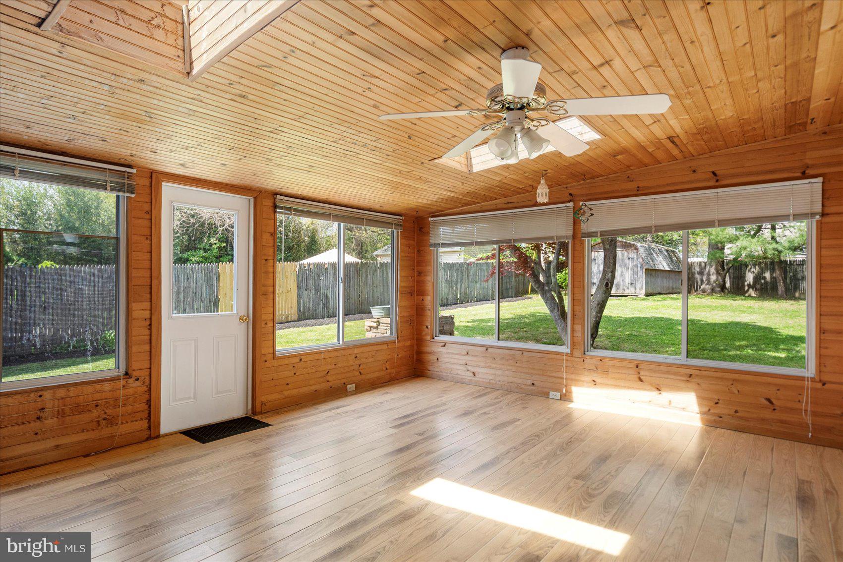 1828 Wycliffe Road Baltimore, MD 21234 - Photo 13 of 41 a view of an empty room with a window and wooden floor