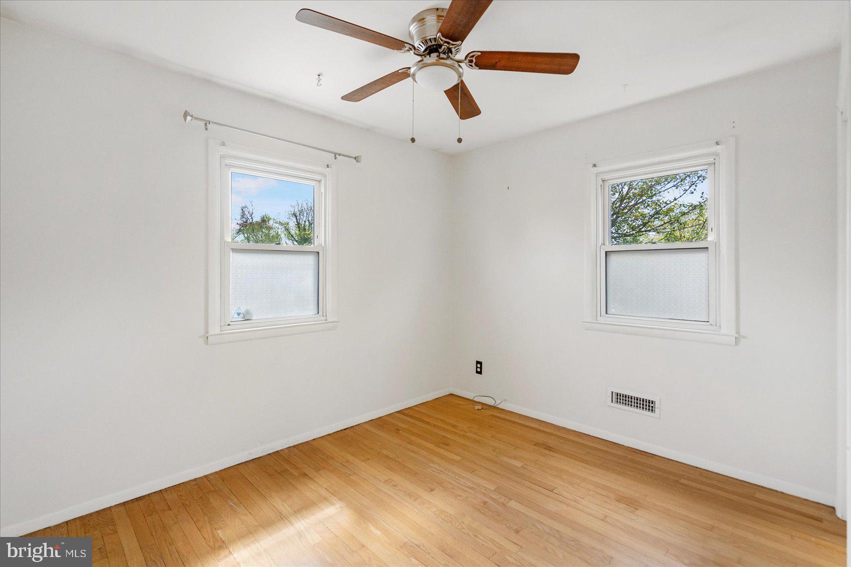1828 Wycliffe Road Baltimore, MD 21234 - Photo 21 of 41 a view of empty room with window and ceiling fan