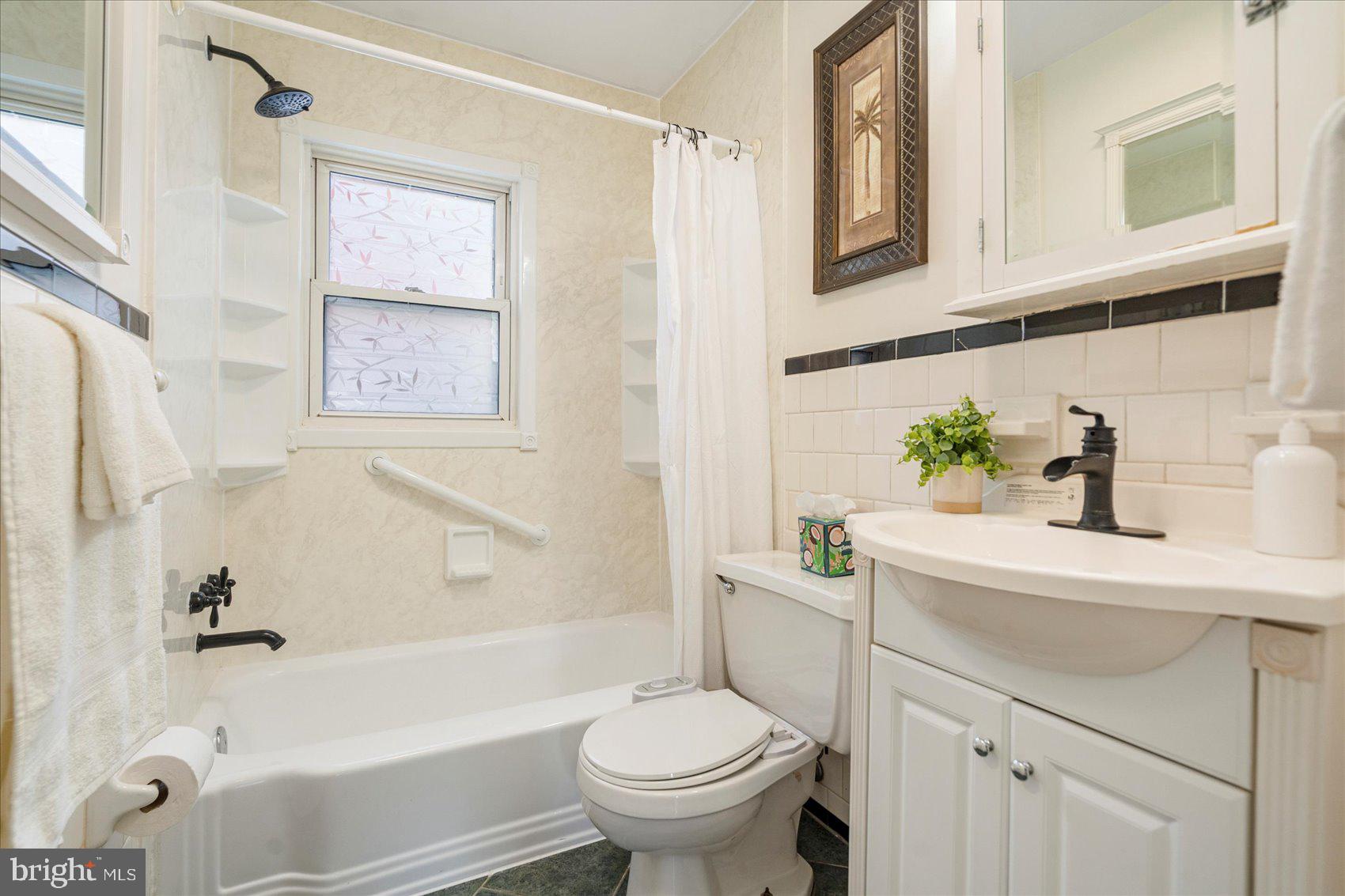 1828 Wycliffe Road Baltimore, MD 21234 - Photo 23 of 41 a bathroom with a sink a toilet and a bathtub